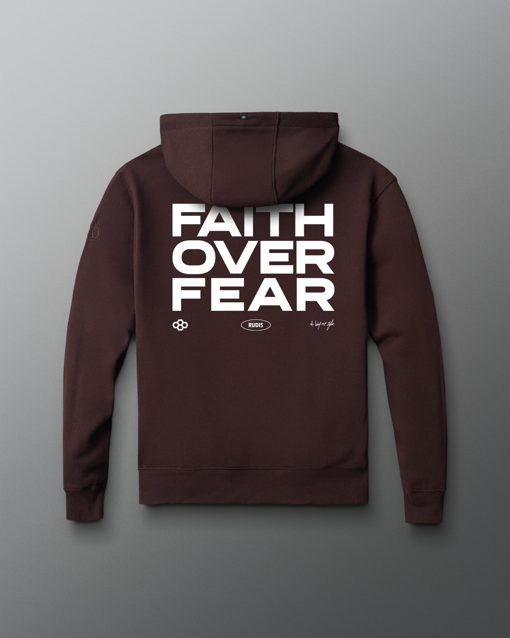 Brown hoodie with 'Faith Over Fear' text on the back against a gray background