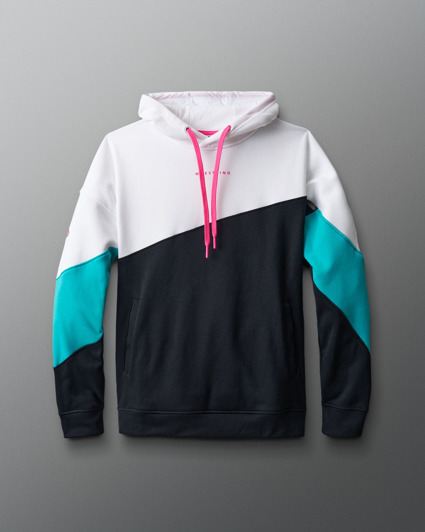 Color-blocked hoodie with white, black, and teal sections on a gray background