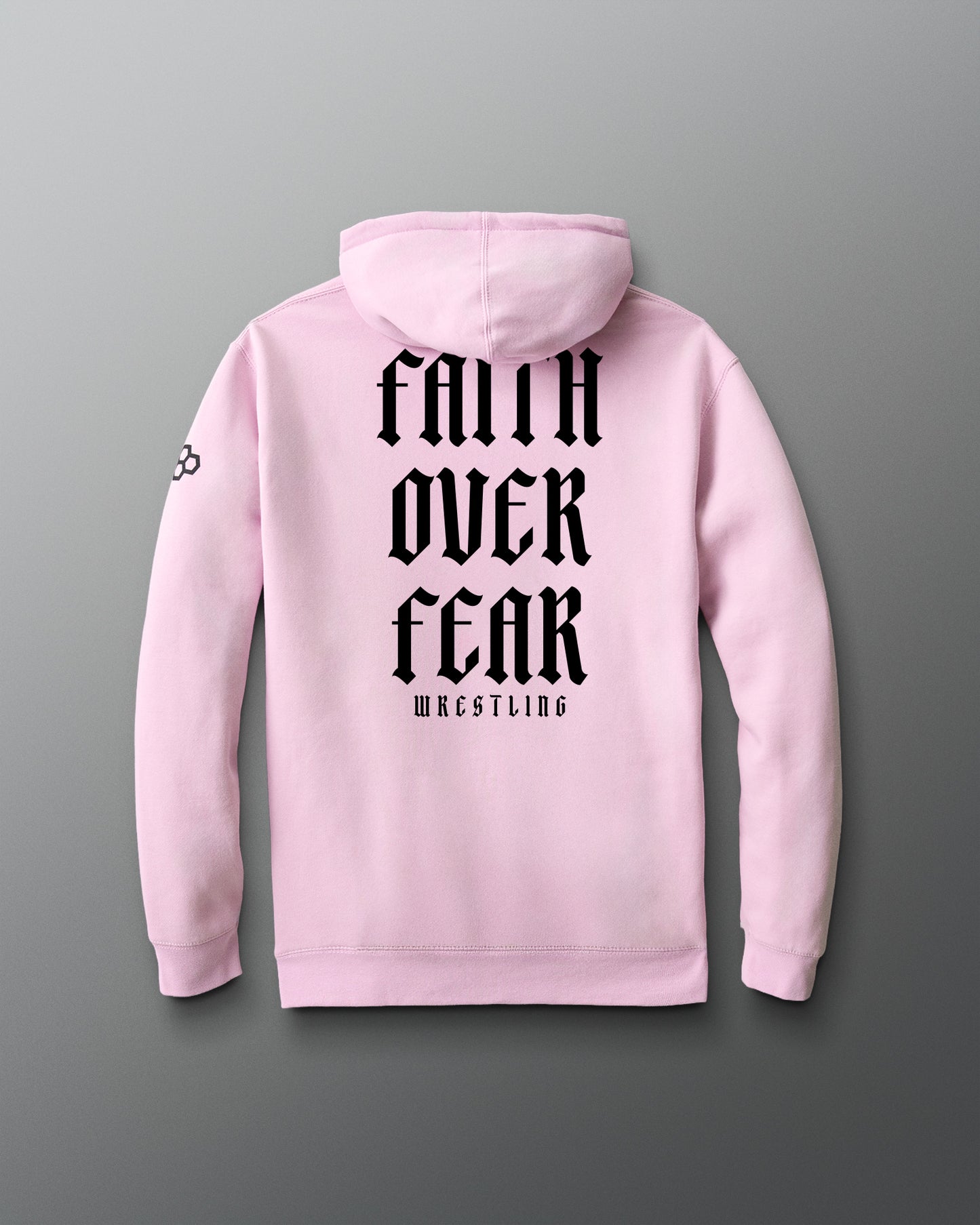 Pink hoodie with 'Faith Over Fear Wrestling' text on the back against a gray background