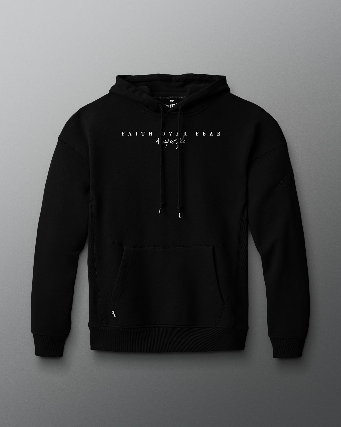 Black hoodie with front faith over fear text on a gray background