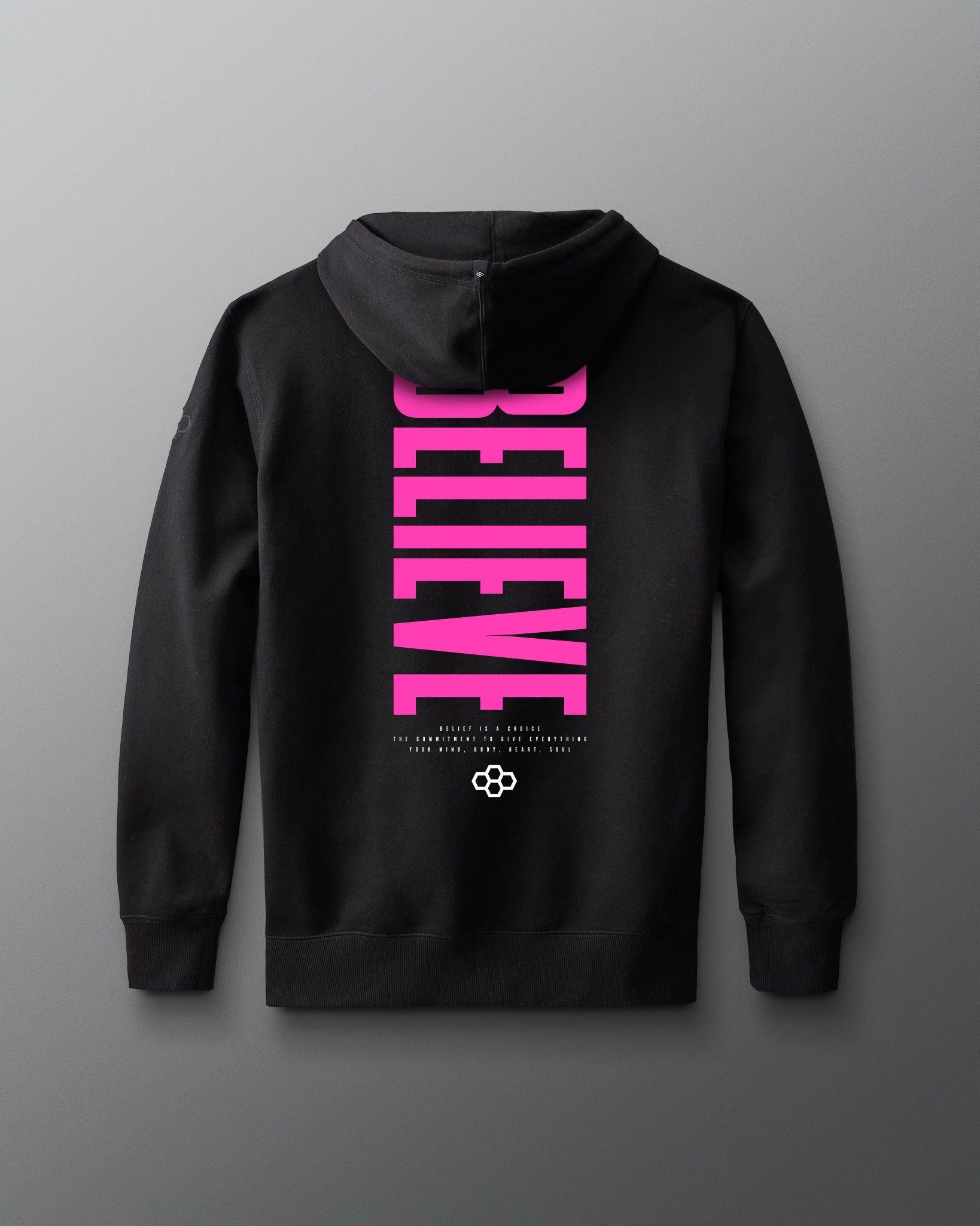 Black hoodie with pink 'BELIEVE' text on a gray background
