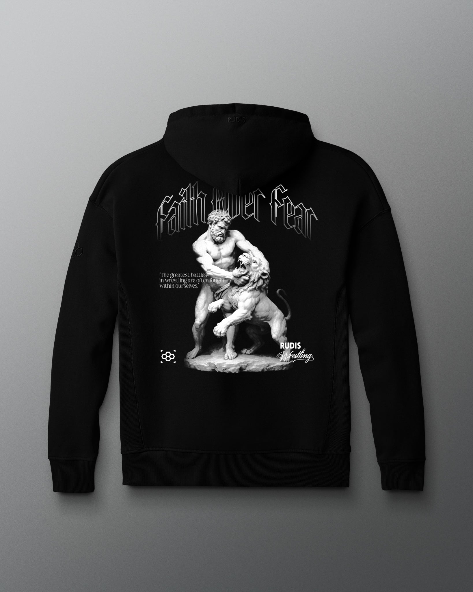 Black hoodie with a graphic design on the back against a gray background