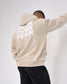 Person wearing a beige hoodie with 'Faith Over Fear' text on the back against a white background