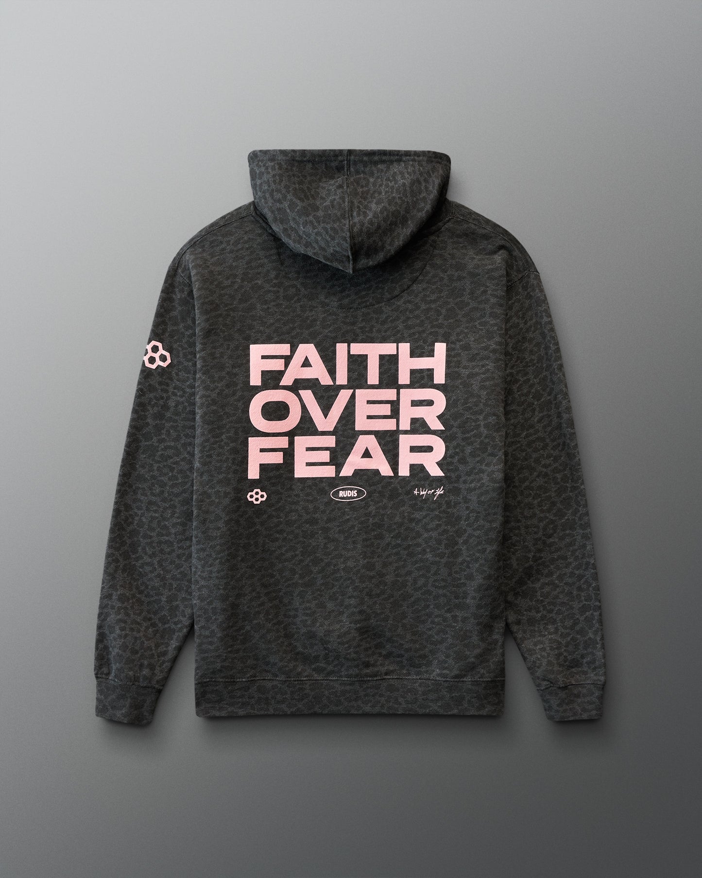 Gray hoodie with animal print and 'Faith Over Fear' text on the back against a gray background