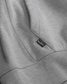Close-up of a gray sweatshirt with a RUDIS label.