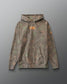 Camouflage hoodie with orange 'For we wrestle not against flesh and blood' text on a gray background