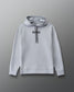 A light gray pullover hoodie with 'RUDIS' printed in black across the chest, featuring black drawstrings, shown against a dark gray gradient background.