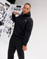 Male model styling the RUDIS Essential Hex Relaxed Comfort Fleece Hoodie in black, featuring a minimal chest logo and relaxed silhouette.
