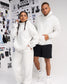 Male and female models wearing RUDIS Essential Hex Relaxed Comfort Fleece Hoodies in Heather Silver with tonal chest logos and matching athletic apparel.