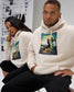Male and female models seated in RUDIS Divine Struggle fleece hoodies in Bone, highlighting the wrestling-inspired artwork and relaxed comfort fit.
