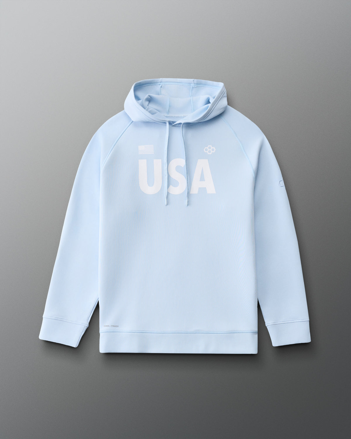 Front view of RUDIS USA Cool Feel Hoodie in Ice blue, featuring bold white USA lettering, American flag detail, RUDIS Hex logo, drawstring hood, and raglan sleeves.
