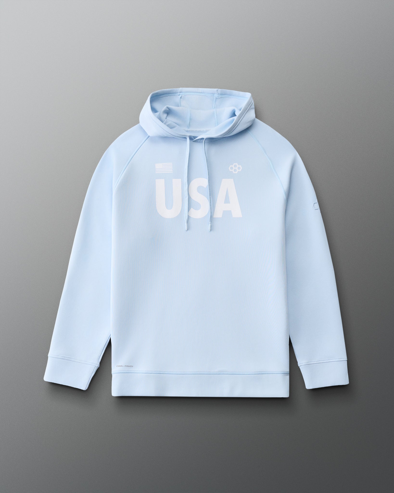 Front view of RUDIS USA Cool Feel Hoodie in Ice blue, featuring bold white USA lettering, American flag detail, RUDIS Hex logo, drawstring hood, and raglan sleeves.