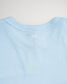 A light blue t-shirt showcases a simple design with white horizontal lines at the back neck area