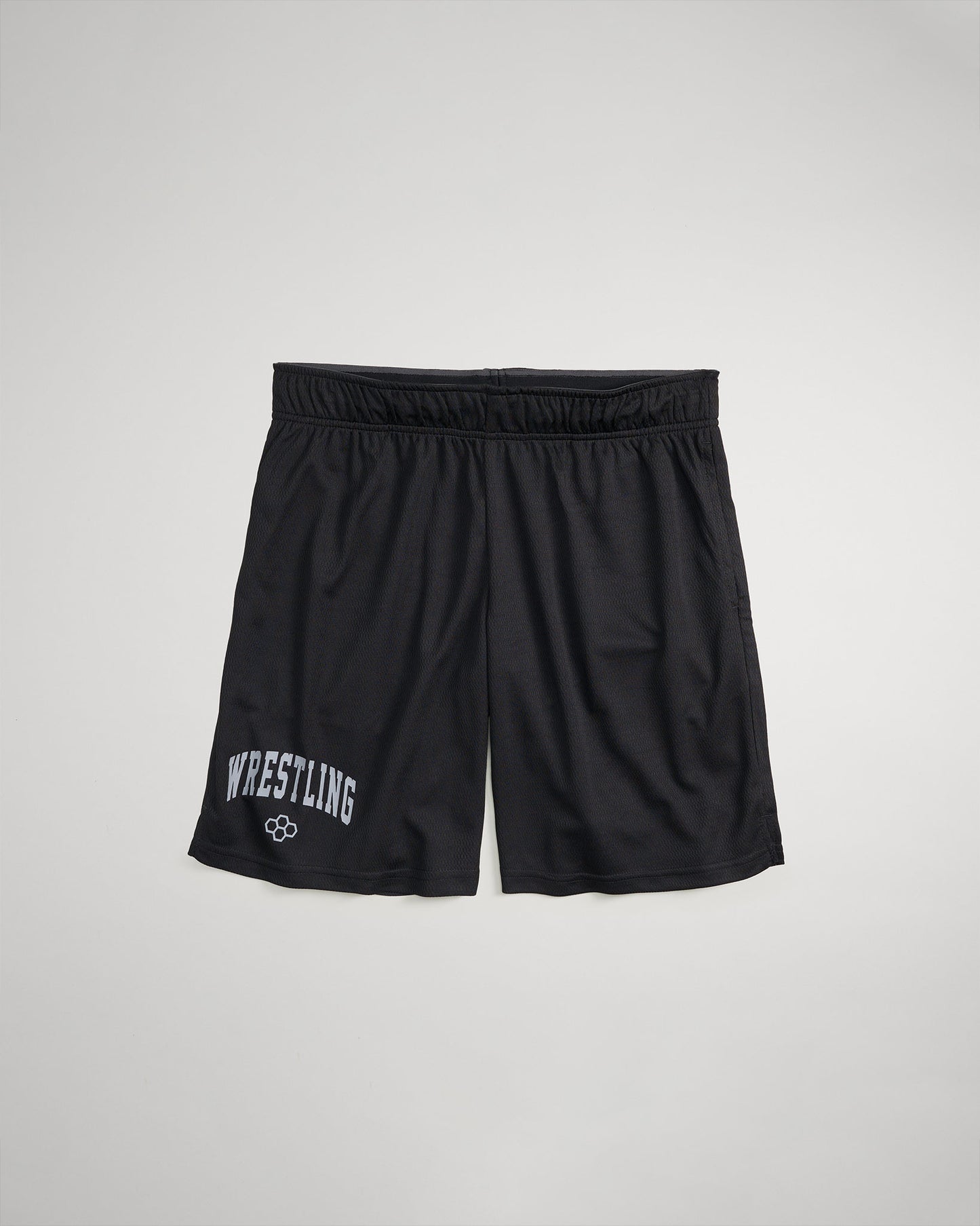 Black wrestling shorts featuring the word WRESTLING in bold white letters on the left leg