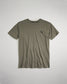This image displays a minimalist olive green t-shirt featuring a small decorative logo on the left chest area set against a light backdrop