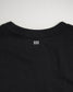 A close-up view of the back neckline of a black T-shirt featuring two white horizontal stripes and a minimalistic design