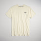 A soft yellow t-shirt featuring a small black floral logo on the upper left chest area displayed against a neutral background