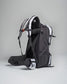 A sleek black and gray backpack with ergonomic straps and a side pocket designed for comfort and durability