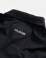 A close-up view of a black athletic polo shirt featuring a slim structured collar and a distinctive logo that reads RUDIS