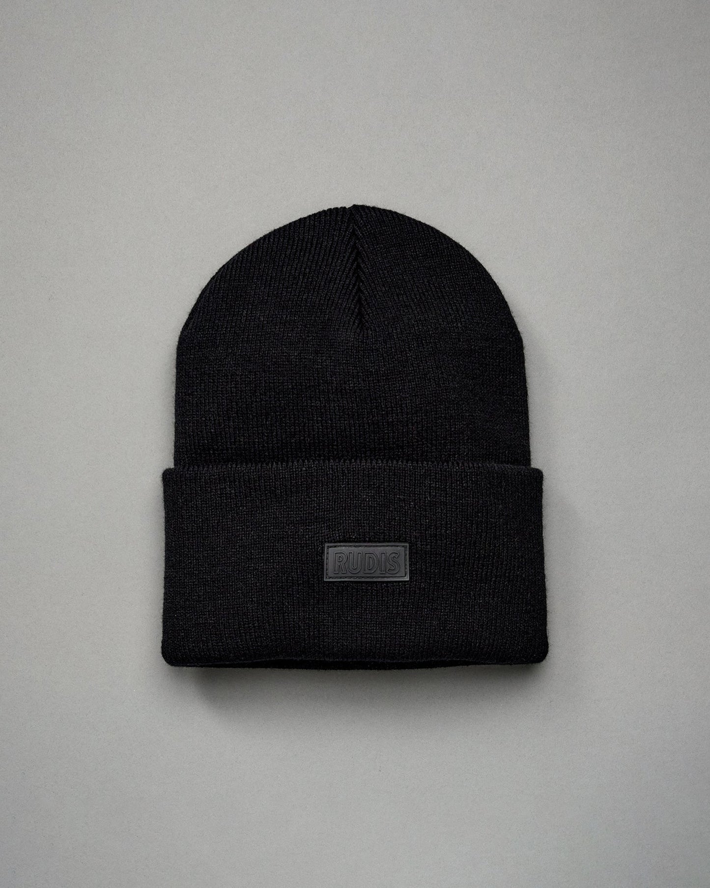 Bonnet à rabat avec patch en silicone RUDIS