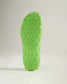 A vibrant green shoe sole featuring a textured design that enhances grip and traction