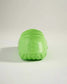 A rear view of a bright green shoe with a textured sole and hexagonal design on the side showcasing its unique style and design elements