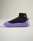 A modern high-top sneaker featuring a black upper and a distinctive purple sole emphasizing a stylish and athletic design