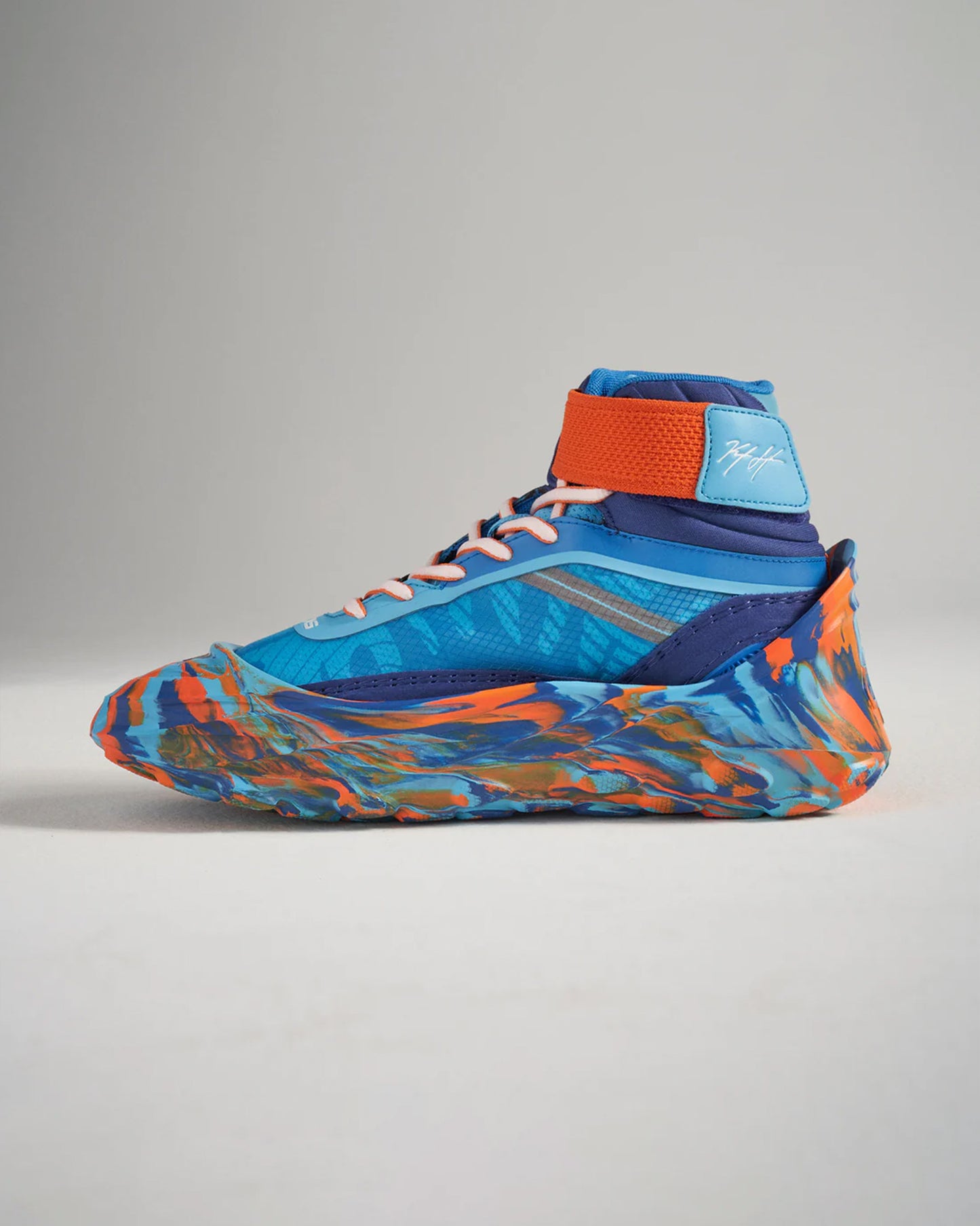 A vibrant high-top athletic shoe featuring a mix of blue and orange colors designed for performance and style