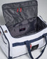 A white utility duffel bag with a spacious interior and red zip pulls showcasing compartments for organized storage
