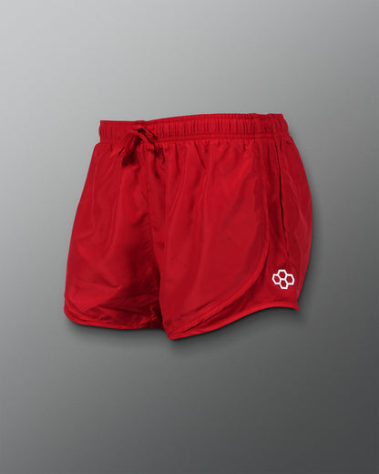 A pair of vibrant red athletic shorts featuring a drawstring waist and a mesh side panel for breathability