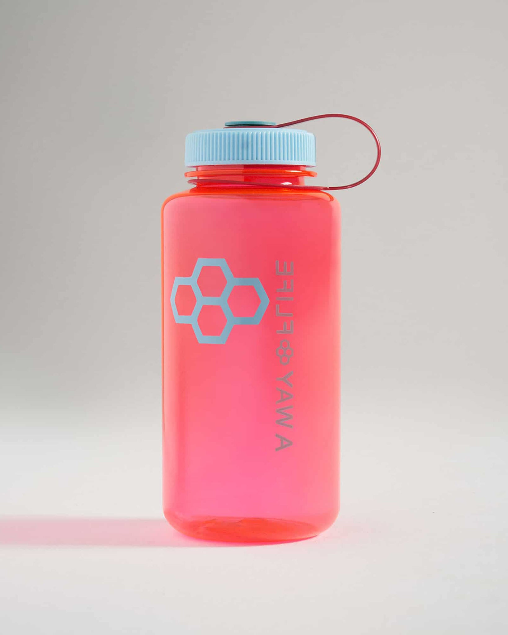 Vibrant pink water bottle with a light blue lid and honeycomb logo perfect for hydration on the go