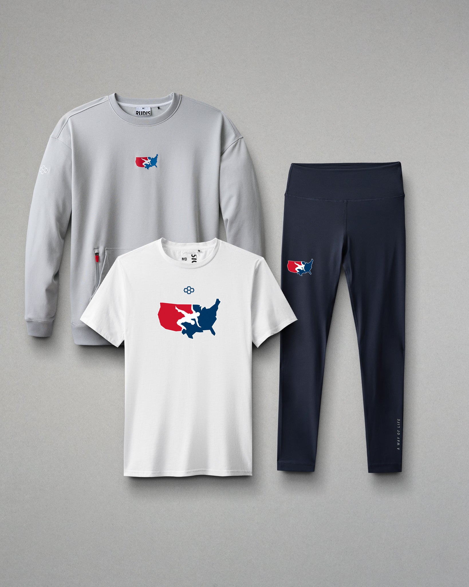 Gray sweatshirt, white t-shirt, and black leggings with a logo on a gray background