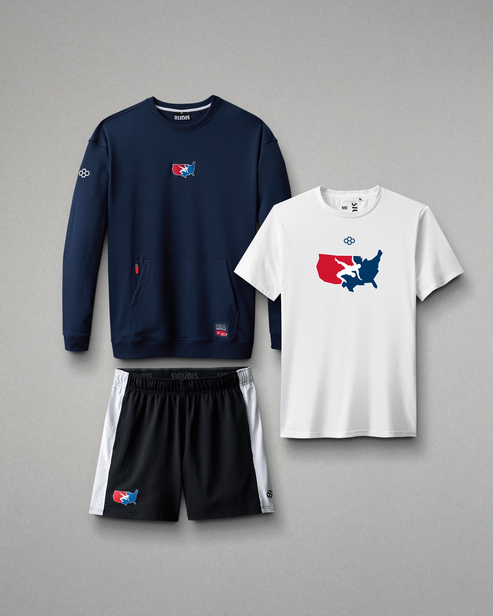 Navy sweatshirt, white t-shirt, and black shorts with a logo on a gray background