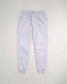 Light gray sweatpants featuring a comfortable waistband drawstring closure and side pockets ideal for casual and athletic wear