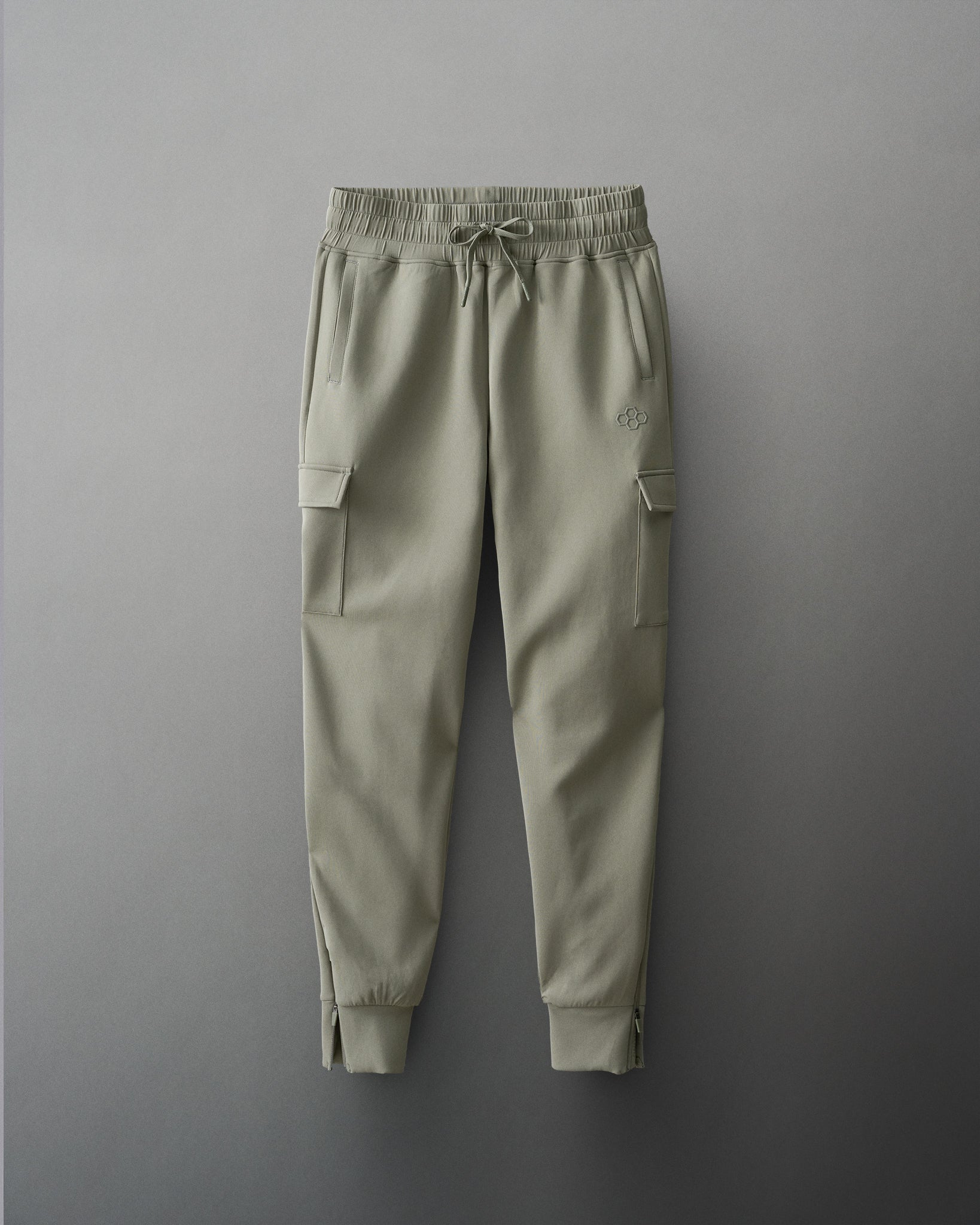Green cargo jogger pants on a gray background