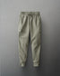 Green cargo jogger pants on a gray background
