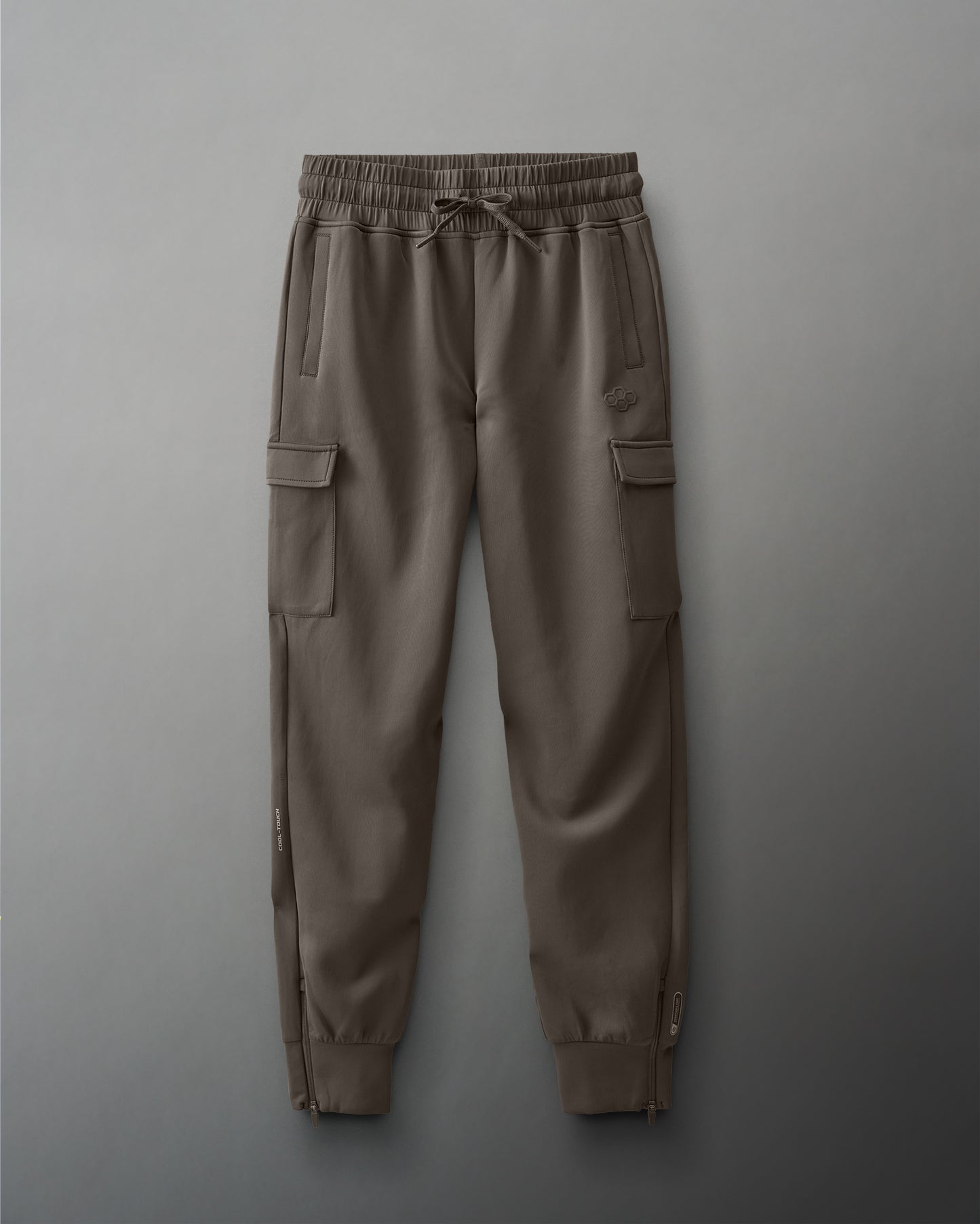 Brown cargo pants on a gray background