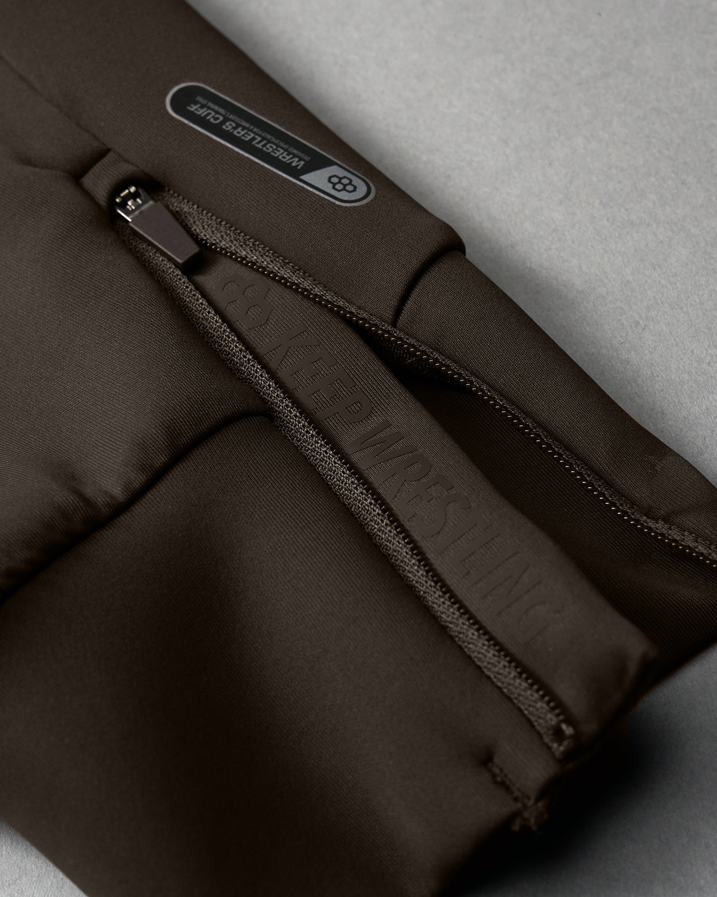 Brown bag with a visible brand logo on a gray background