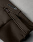 Brown bag with a visible brand logo on a gray background