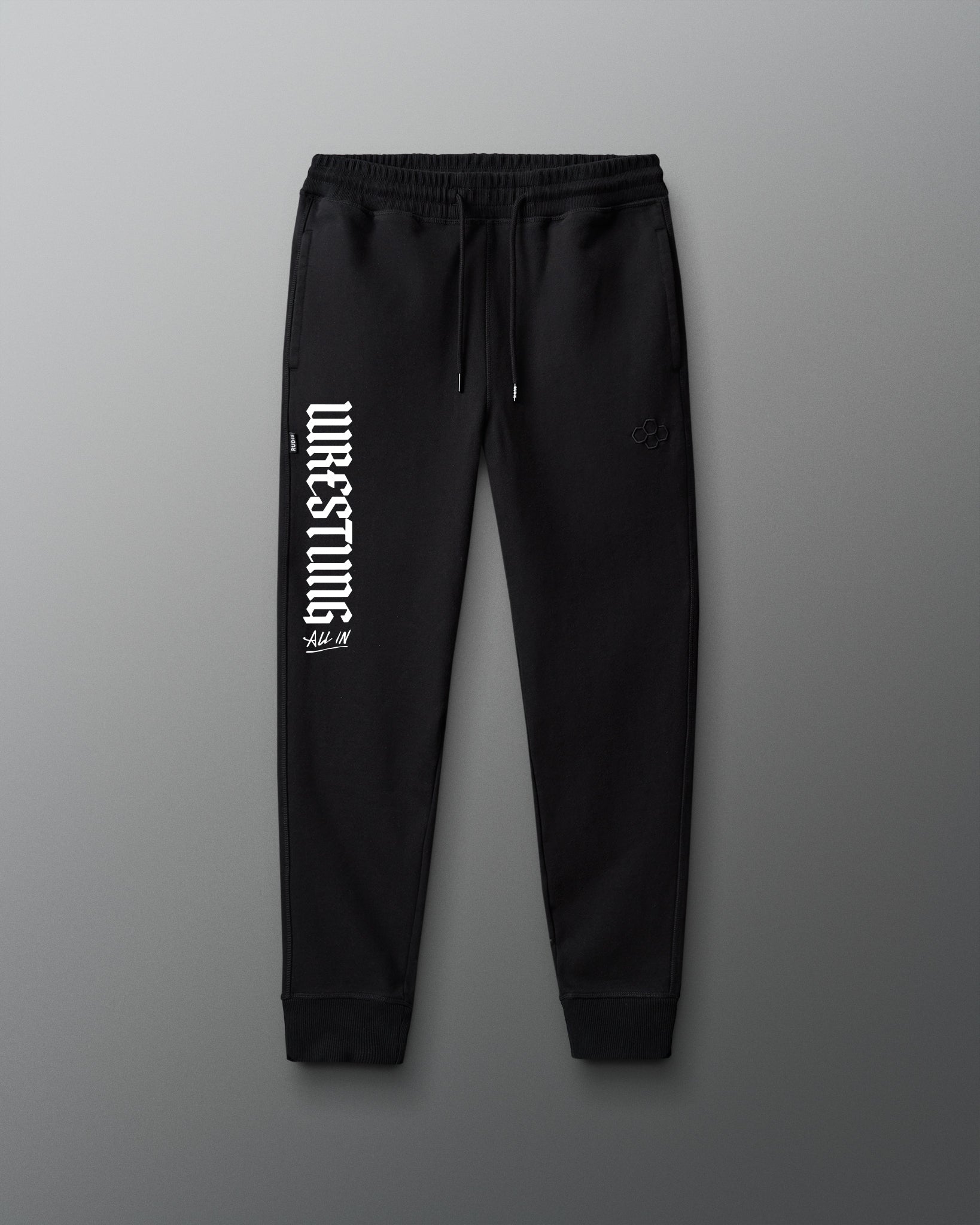 Black sweatpants with white text on a gray background
