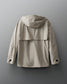A beige windbreaker jacket back side view with a hood, designed for adults. 
