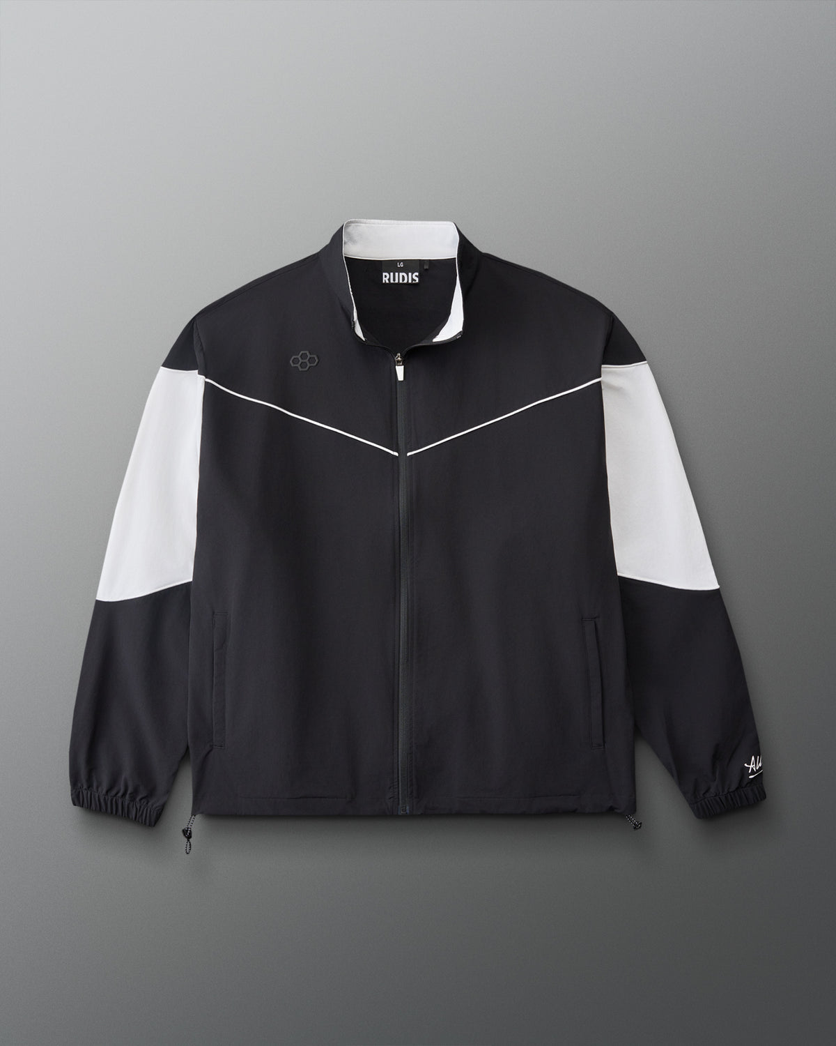 Front view of the RUDIS Full Zip Movement Podium Jacket in black with white sleeve panels, full-zip closure, and RUDIS logo.