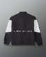 Back view of the RUDIS Full Zip Movement Podium Jacket in black and white featuring “A WAY OF LIFE” across the back.