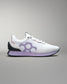 White sneaker with purple sole on a gray background