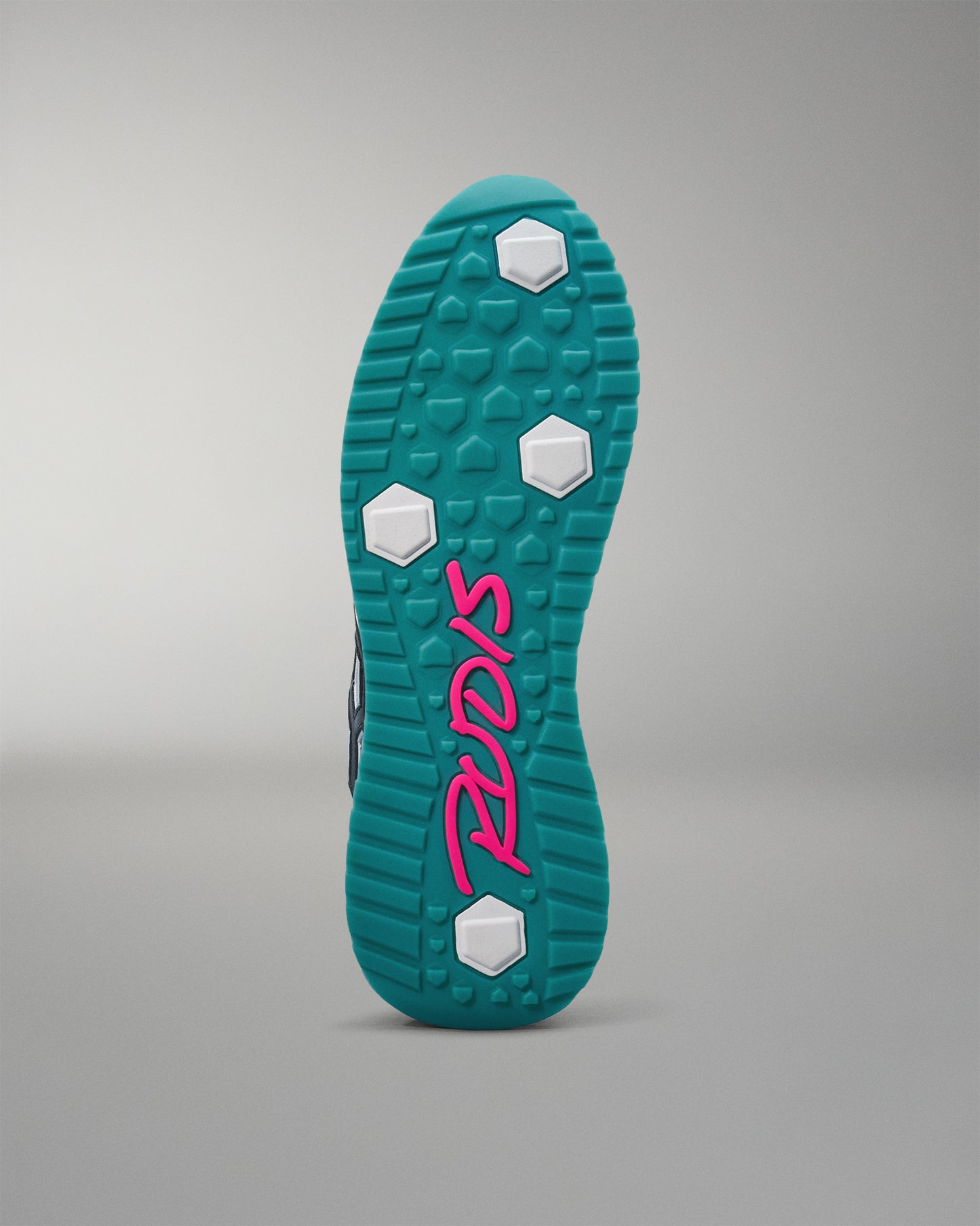 Teal shoe sole with pink logo on a gray background