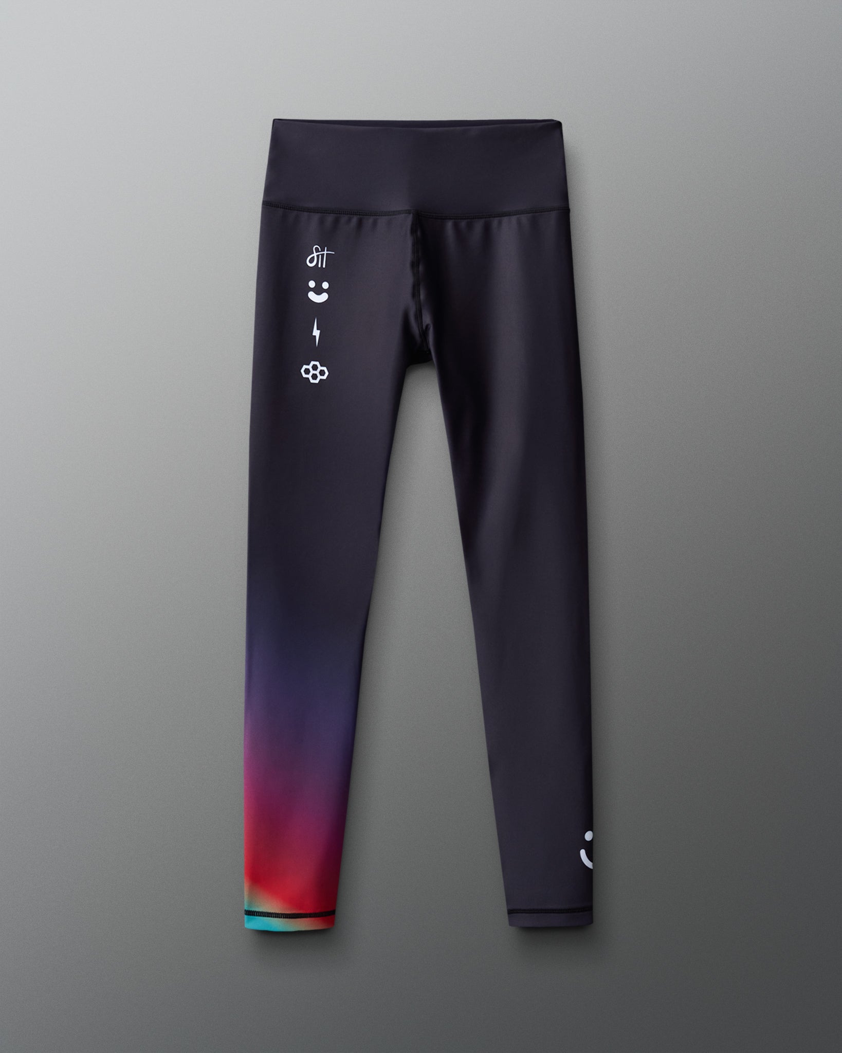 Gradient leggings with colorful design on a gray background