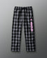 Black and white plaid pants with pink text on a gray background