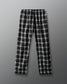 Black and white plaid pants on a gray background
