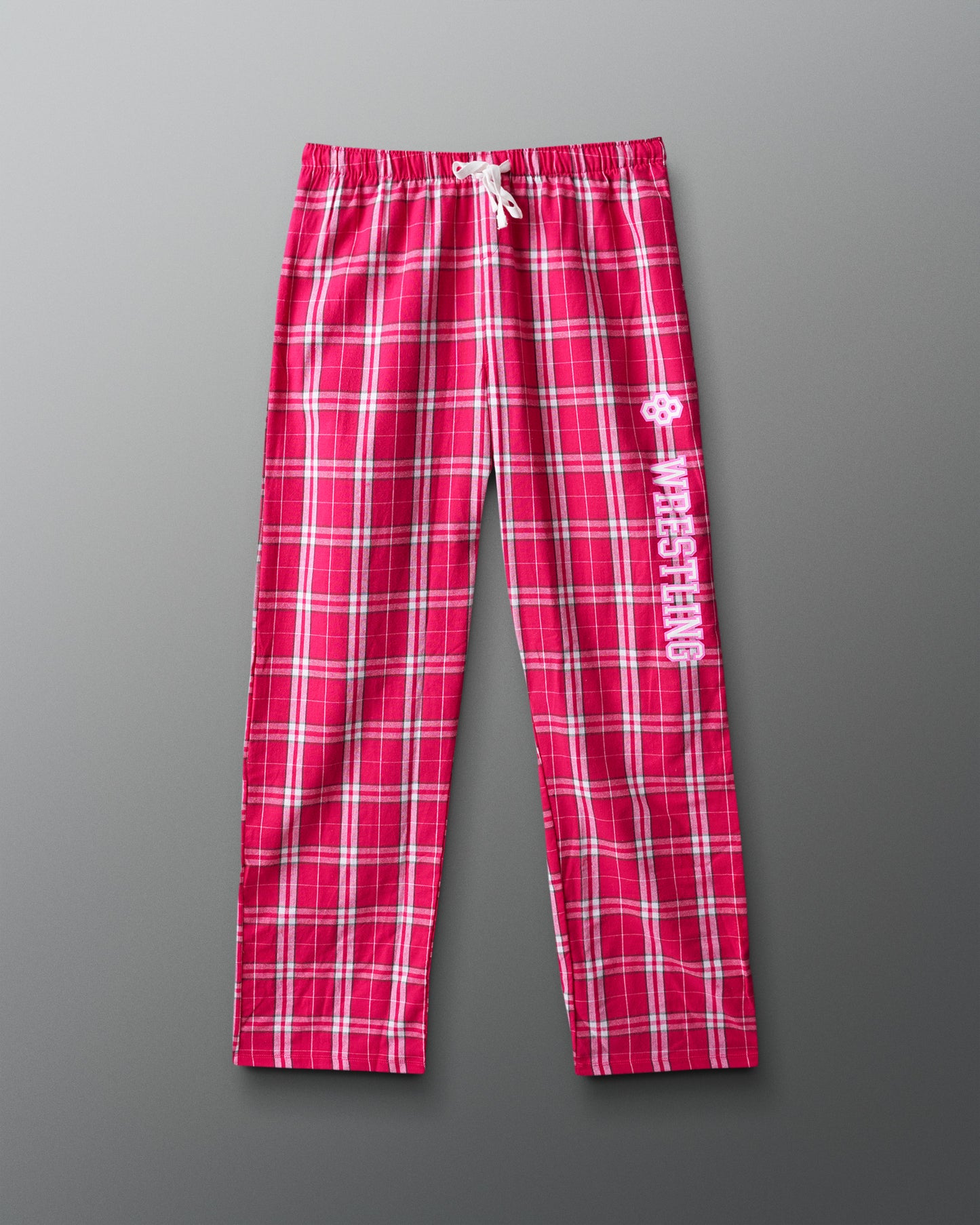 Red plaid pants with a logo on a gray background
