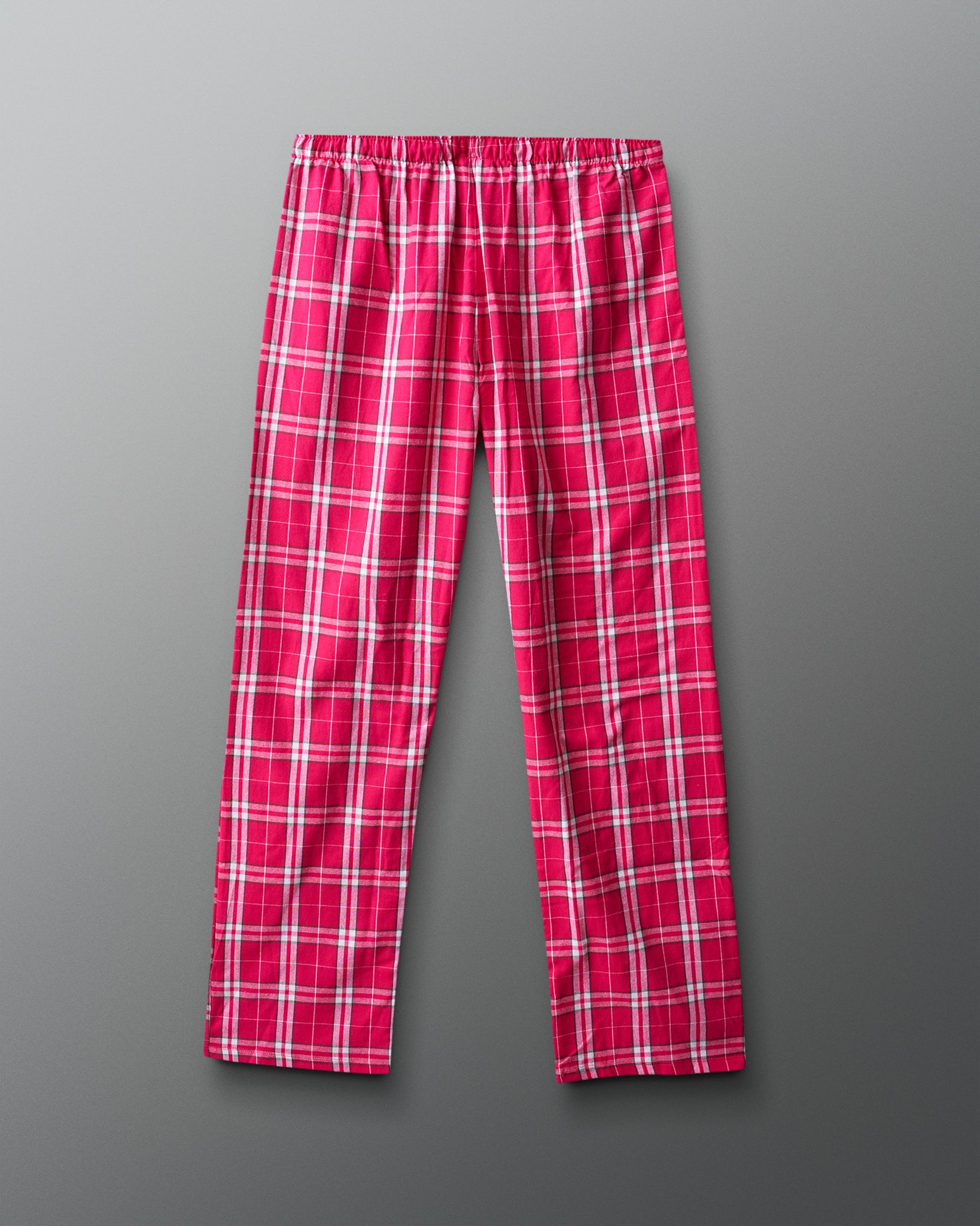 Pink plaid pants on a gray background